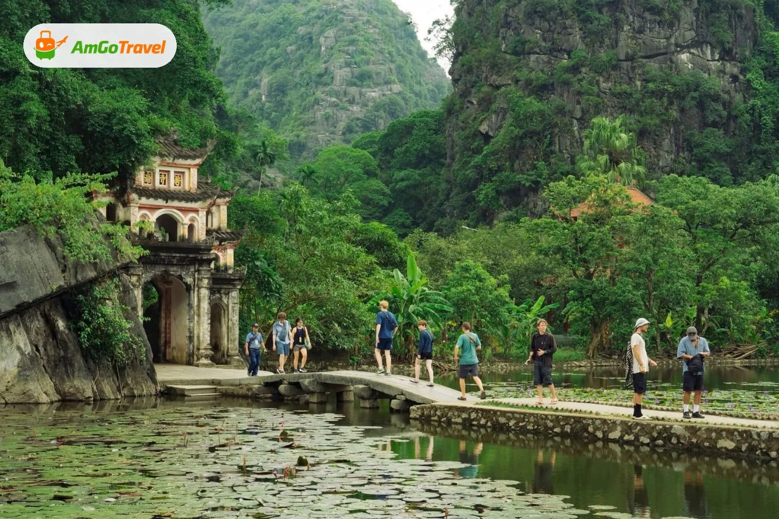 Visitors on path to Bich Dong pagoda gate