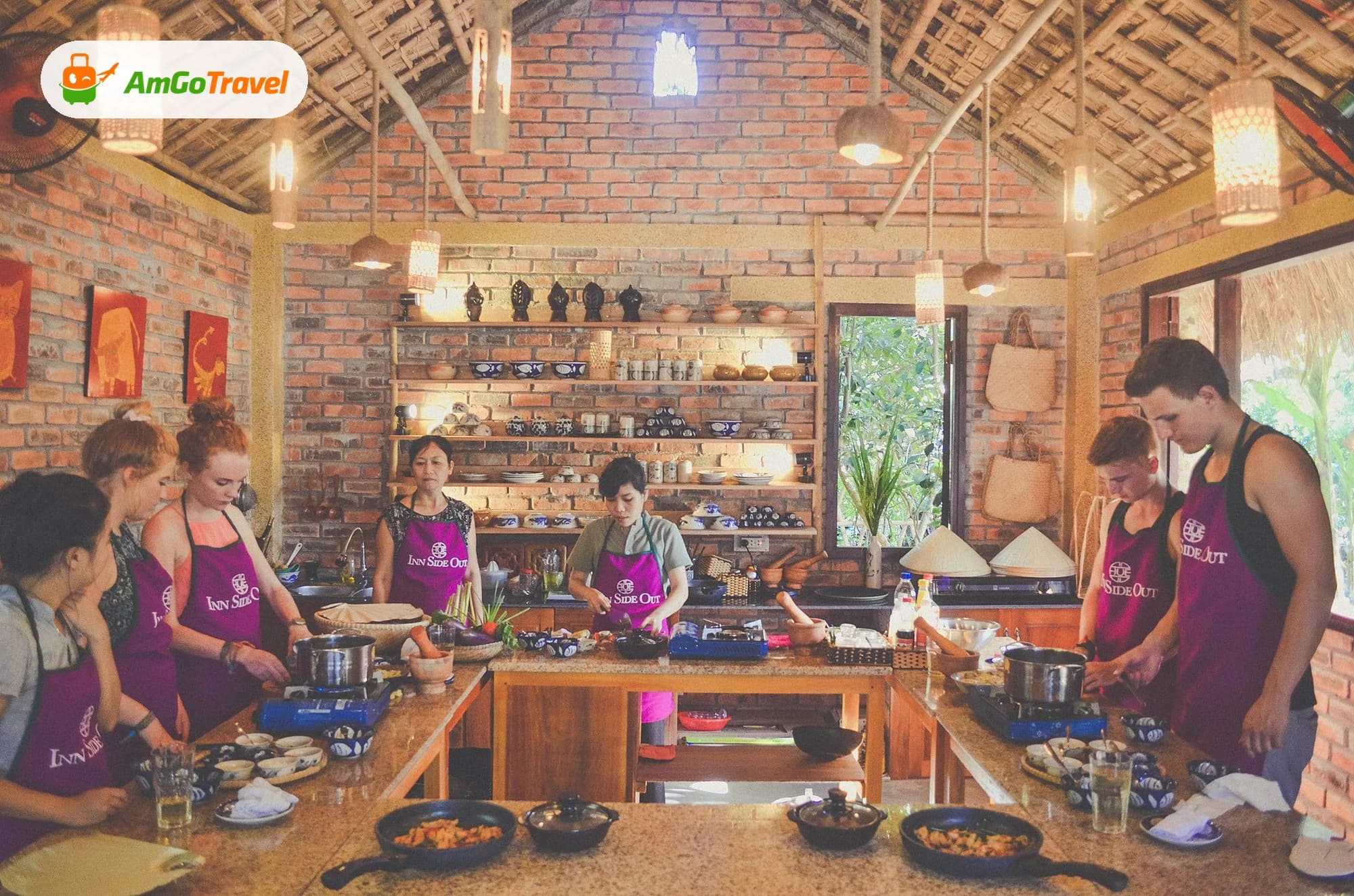 Travellers cooking at stations in a cooking class