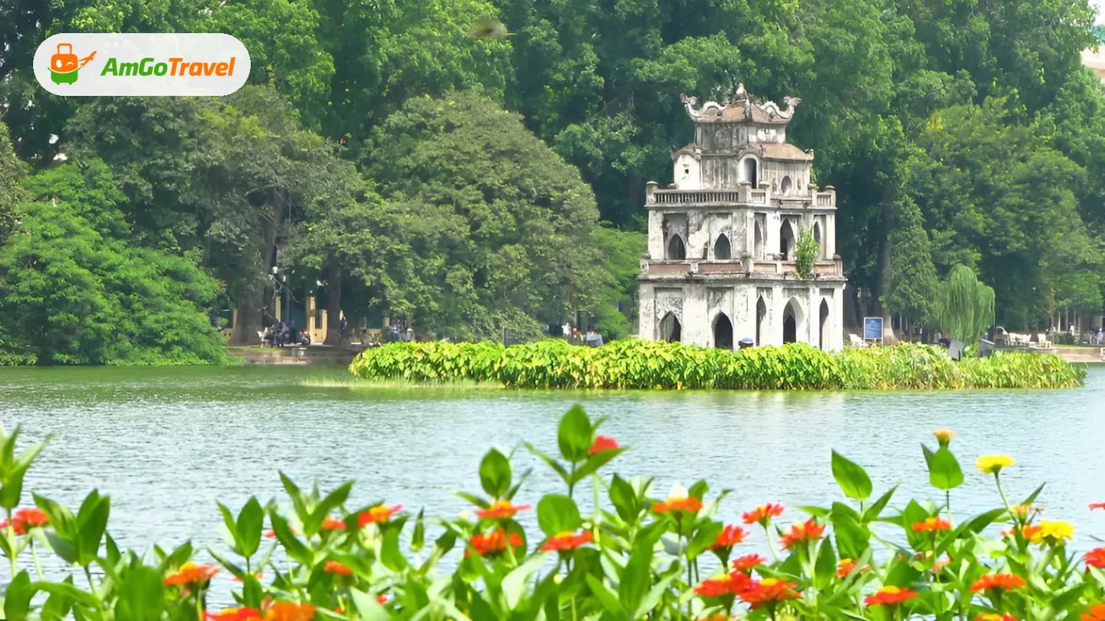 Turtle Tower on Hoan Kiem Lake framed by flowers