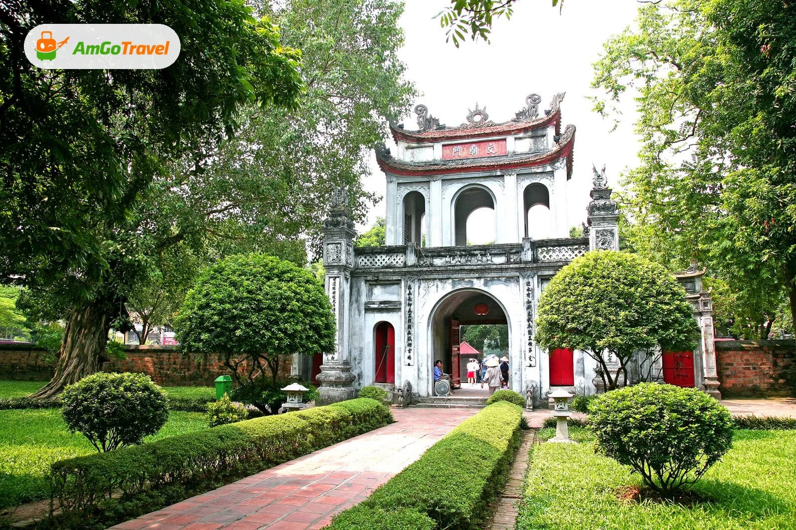 Gate of the Temple of Literature in Hanoi among green gardens