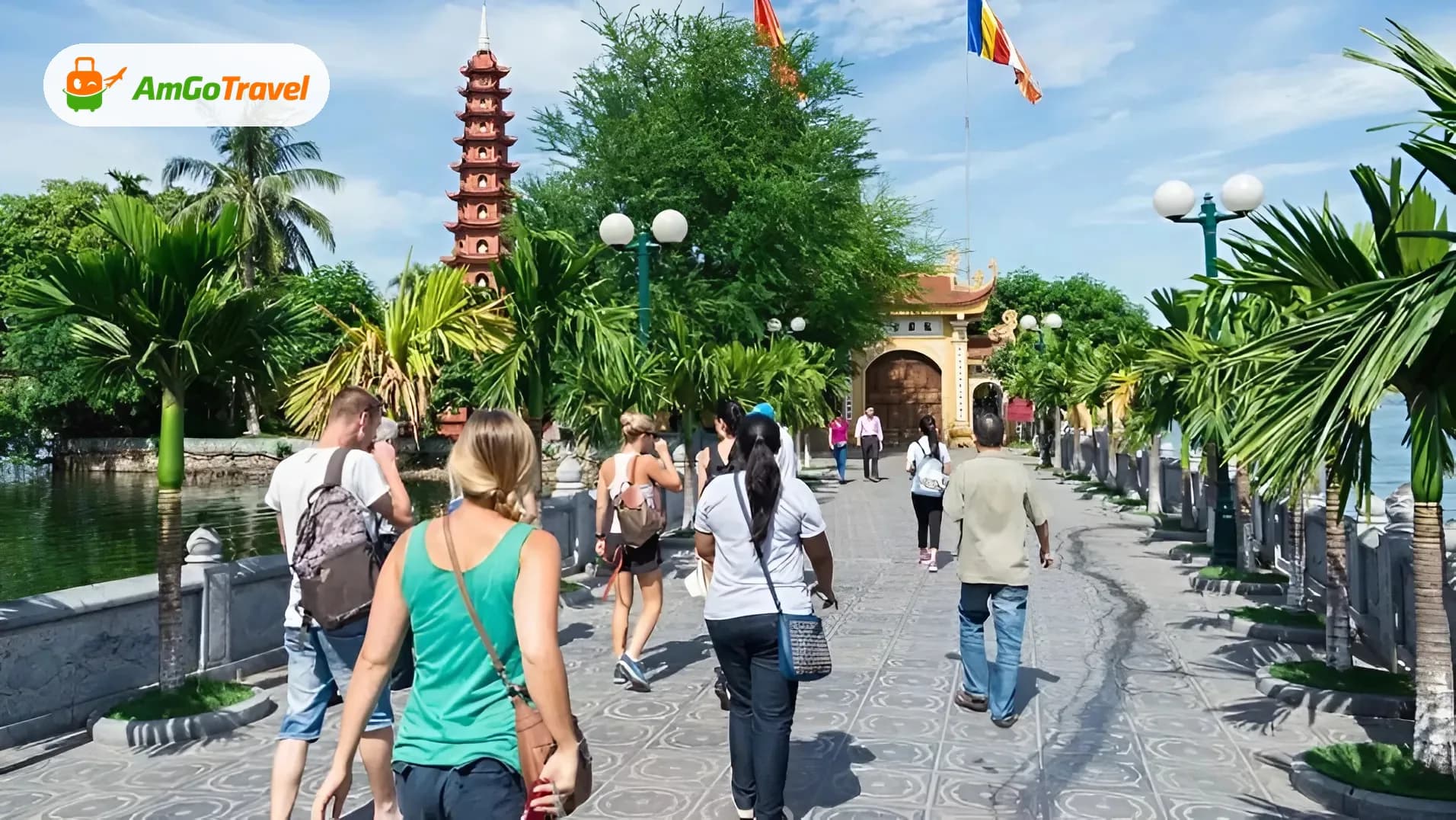 Visitors walking path to Tran Quoc Pagoda tower