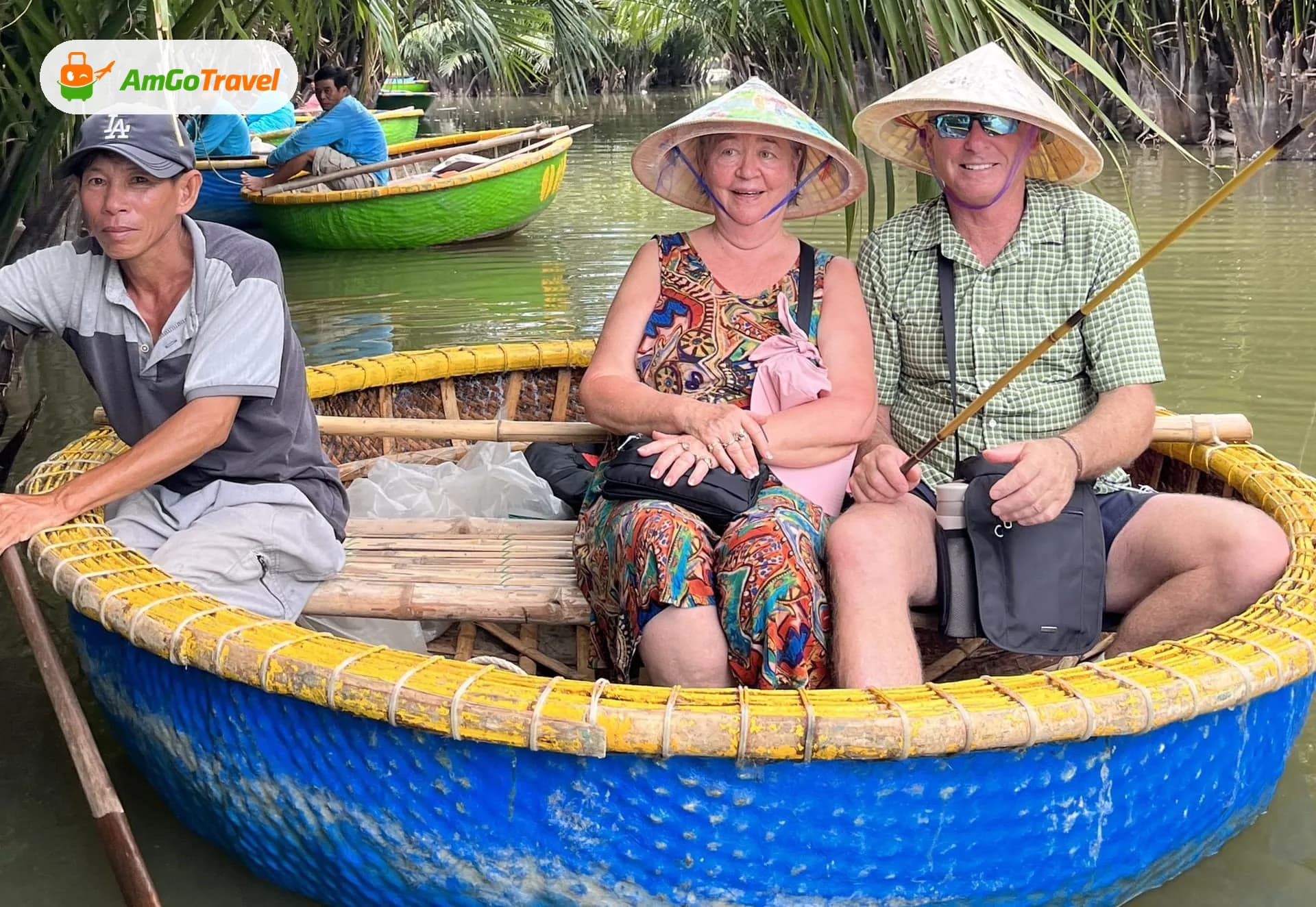 Couple in conical hats riding a blue round basket boat