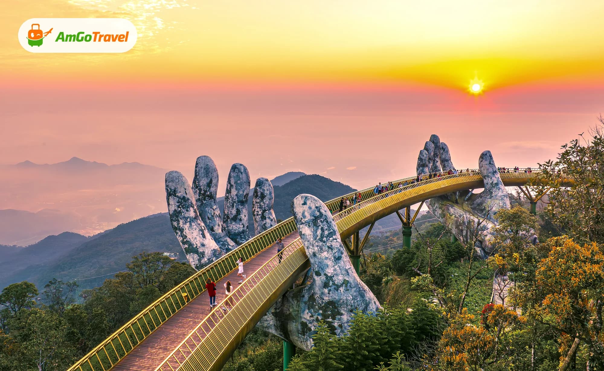Golden Bridge held by giant stone hands at sunset, Ba Na Hills