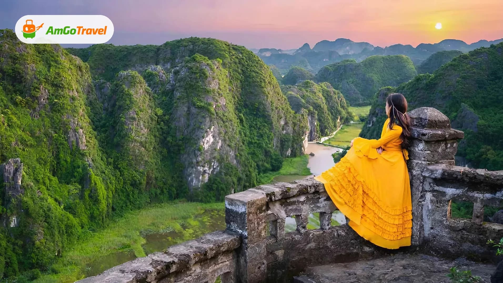 Woman in yellow dress at Mua Cave viewpoint