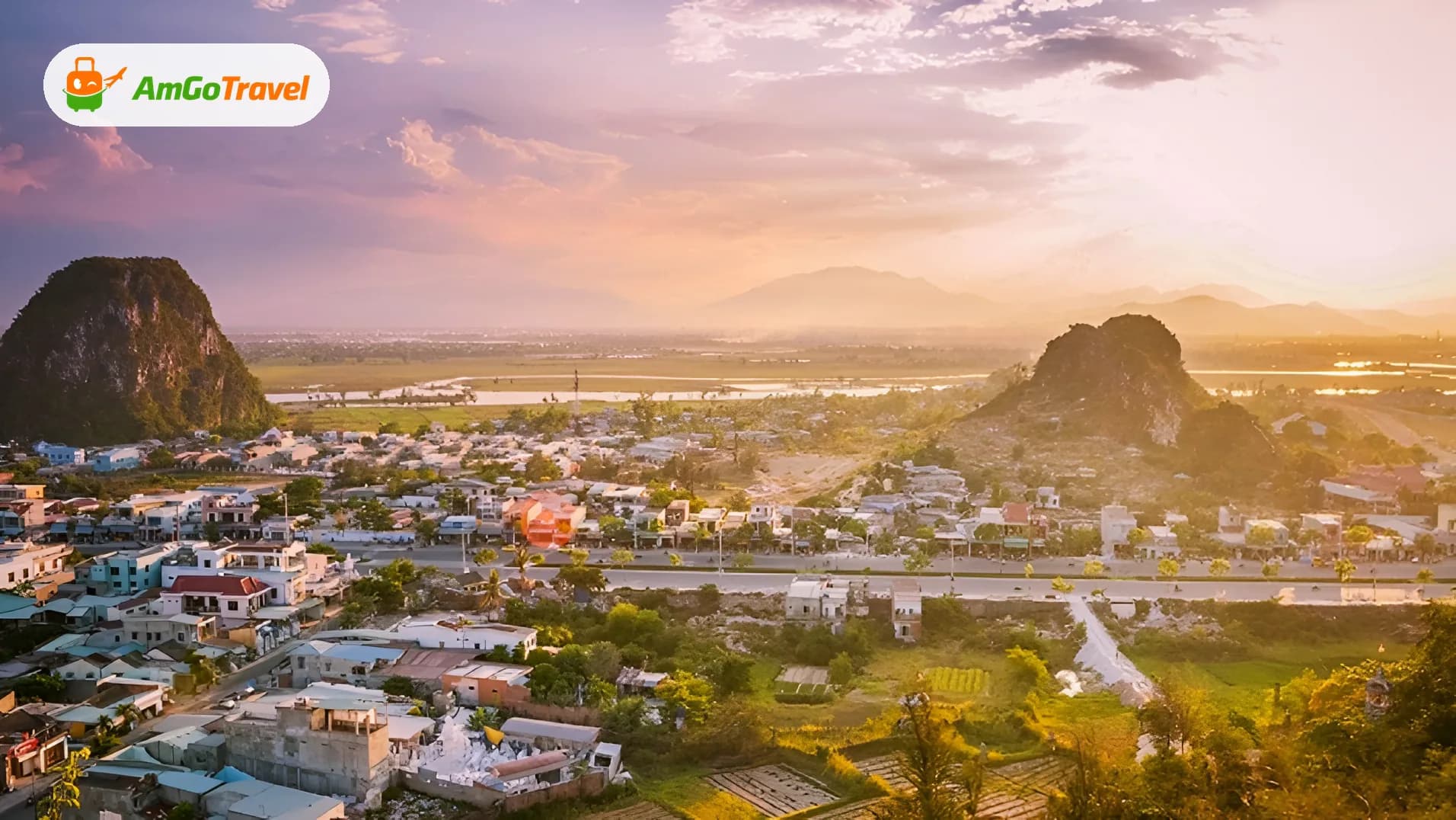 Aerial sunset over Marble Mountains and Da Nang suburbs
