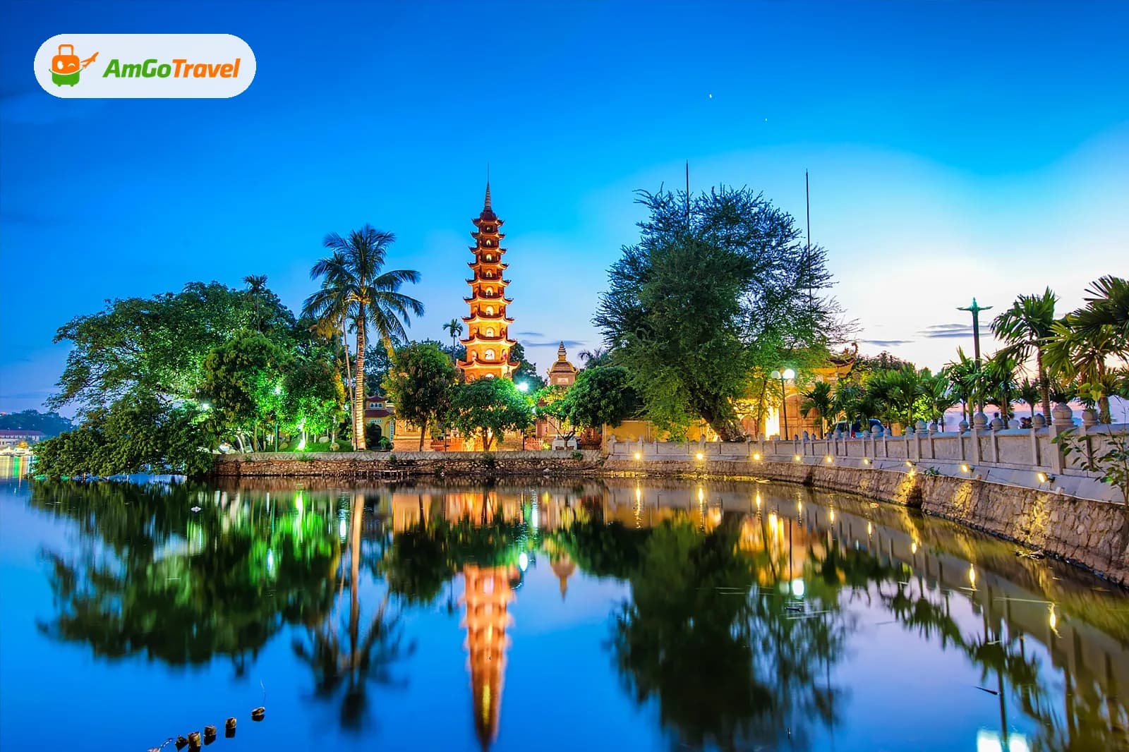 Tran Quoc Pagoda tower reflected in West Lake at dusk